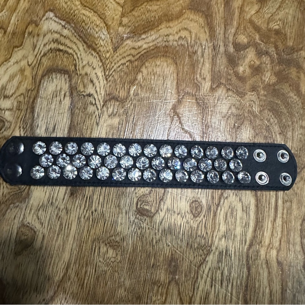 Gorgeous black leather adjustable cuff bracelet covered in rhinestones